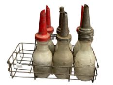 CIRCA 1950'S GLASS MOTOR OIL ONE LIQUID QUART BOTTLES WITH PLASTIC AND METAL SPOUTS INCLUDING CRATE