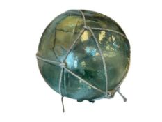 LARGE 20TH CENTURY VINTAGE JAPANESE HAND BLOWN GLASS FISHING FLOAT WITH NET AQUA TINTED GLASS