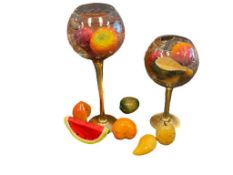GILDED CUT GLASS BULBOUS VOTIVE HOLDERS FILLED WITH DECORATIVE FRUIT, SOME FRUIT ARE CARVED STONE