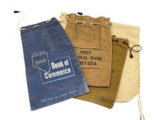 FOUR VINTAGE BANK BAGS INCLUDING THREE FROM THE FIRST NATIONAL BANK OF NEVADA