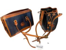 TWO DOONEY & BOURKE NAVY BLUE AND BLACK LEATHER LADIES' HANDBAGS WITH BROWN LEATHER ACCENTS
