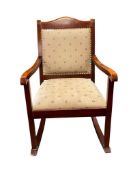CHERRY FINISH ROCKING CHAIR WITH FLORAL PADDED UPHOLSTERY