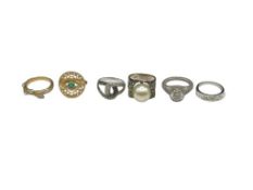 SIX STERLING SILVER FASHION RINGS FEATURING VARIOUS DESIGNS
