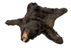VINTAGE BLACK BEAR FULL BODY TAXIDERMY RUG WITH FULL HEAD AND ATTACHED CLAWS