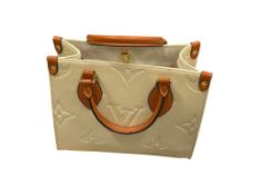 MARKED LOUIS VUITTON ON THE GO SMALL TOTE IN BEIGE WITH DUST COVER