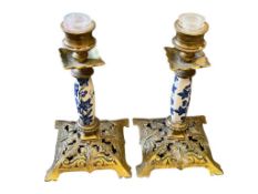 PAIR OF VICTORIAN PERIOD PIERCED BRASS AND PORCELAIN COLUMN CANDELSTICKS WITH DECORATIVE SQUARE B...