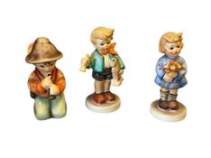 THREE SMALL GOEBAL HUMMEL FIGURINES LITTLE TOOTER, GIRL WITH NOSEGAY, AND BOY WITH HORSE AND HORN