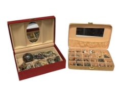 TWO JEWELRY CASES FILLED WITH COSTUME JEWELRY INCLUDING SEVERAL PAIRS OF EARRINGS, RINGS, AND MORE