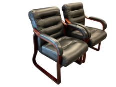 PAIR OF EXECUTIVE OFFICE CHAIRS, MAHOGANY FINISH WOOD FRAMES WITH FAUX BLACK LEATHER UPHOLTERY