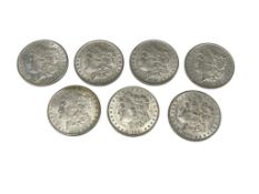 SEVEN ASSORTED U.S. MORGAN SILVER DOLLARS