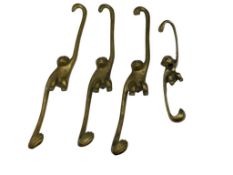 FOUR MID-CENTURY FIGURAL BRASS MONKEY WARDROBE HANGERS