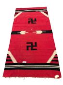 EARLY 20TH CENTURY CHIMAYO WEAVING FEATURING NATIVE AMERICAN SWASTIKA WITH RED BACKGROUND