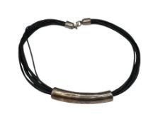 VINTAGE STERLING SILVER AND MULTI-STRAND LEATHER NECKLACE