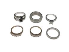 SIX STERLING SILVER FASHION RINGS FEATURING CZ DESIGNS