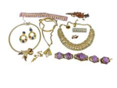 ASSORTED RHINESTONE AND GOLD TONE JEWELRY INCLUDING NECKLACES, CLIP-BACK EARRINGS, AND MORE