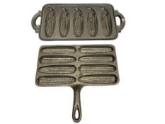 TWO CAST IRON CORN BREAD MOLD BAKING PANS, ONE MADE BY JOHN WRIGHT, BOTH MADE IN USA