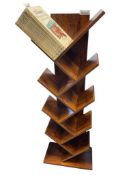 UNIQUE ALTERNATING ANGLE BOOK SHELF FEATURING SEVERAL TIERS OF CROSS HATCHED SHELVES