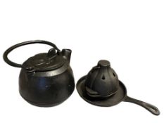 CAST IRON COOKWARE INLCUDING TEAPOT, SMALL SKILLET, AND GARLIC ROASTER