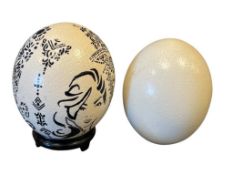 TWO LARGE OSTRICH EGGS, BONE WHITE IN COLOR