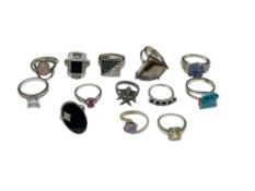 ASSORTED STERLING SILVER FASHION RINGS FEATURING VARIOUS DESIGNS
