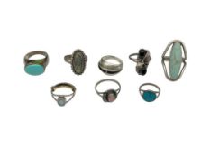 NINE NAVAJO STERLING SILVER SEMI-PRECIOUS STONE RINGS INCLUDING TURQUOISE, SHELL, ONYX, AND MORE