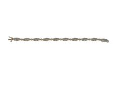 10K TWO-TONE GOLD DIAMOND BRACELET FEATURING ROUND BRILLIANT CUT AND BAGUETTE CUT DIAMONDS