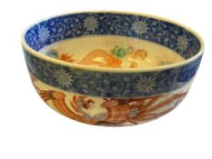 20TH CENTURY CHINESE PORCELAIN DRAGON AND PHOENIX DECORATED BOWL WITH FLORAL DESIGN