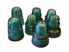 VINTAGE GREEN GLASS HEMINGRAY AND STAR PHONE LINE INSULATORS