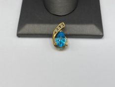 10K YELLOW GOLD BLUE TOPAZ AND DIAMOND PENDANT
