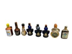 EIGHT ANTIQUE / VINTAGE 1/10 PINT COLLECTIBLE LIQUOR BOTTLES, VAT 69 BUCKET OF BLOOD VIRGINIA CITY