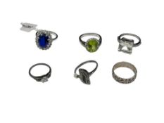 SIX STERLING SILVER FASHION RINGS FEATURING PERIDOT, MARCASITE, PRINCESS CUT CITRINE, AND MORE