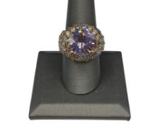 GOLD TONE STERLING SILVER MULTI-COLORED STONE RING FETURING A ROUND CUT PURPLE STONE IN CENTER