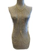 20 STRAND GOLD FINISH BODY CHAIN WITH BEJEWLED CENTER STRAND WITH 40 CLEAR STONES