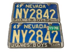 1969 NEVADA BLUE AND WHITE VINTAGE AUTOMOBILE VEHICLE LICENSE PLATES WITH FALLON JONES BOYS FRAMES