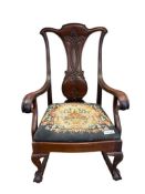 EDWARD VII CARVED MAHOGANY ELBOW ROCKING CHAIR WITH EMBROIDERED FLORAL SEAT