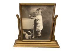 ANTIQUE WOOD FRAME TABLE TOP SWIVEL PICTURE FRAME FEATURING BLACK AND WHITE PHOTO OF CHILD