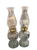 TWO VINTAGE MATCHING OIL LAMPS WITH CHIMNEYS