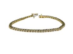 14K YELLOW GOLD DIAMOND TENNIS BRACELET FEATURING 55 ROUND BRILLIANT CUT DIAMONDS