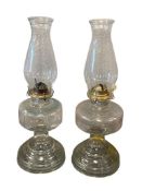 TWO VINTAGE PRESSED GLASS OIL LAMPS WITH CHIMNEY