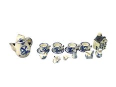 BLUE AND WHITE DELFT MINIATURE FIGURINES, TEA CUPS AND SAUCERS, WINDMIL, TEAPOT