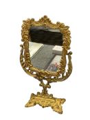 20TH CENTURY GOLD CAST METAL BRASS BRASS FINISH VANITY MIRROR WITH LEAF AND FLORAL DESIGN