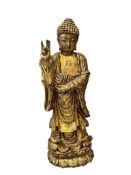 HAND CARVED HEAVY GILT STANDING BUDDHA STATUE WITH GESTURE OF FEARLESSNESS AND SWATSIKA SYMBOL