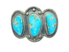 ANTIQUE NAVAJO STERLING SILVER AND TURQUOISE CUFF BRACELET FEATURING THREE TURQUOISE STONES