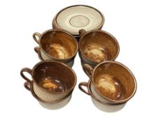 STUDIO POTTERY BROWN GLAZE CUS AND SAUCERS SET OF 8