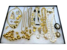 GOLD TONE FASHION AND COSTUME JEWELRY INCLUDING NECKLACES, ROPE CHAINS, CAMEO DESIGNS, AND MORE