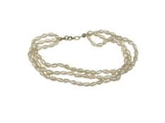 THREE STRAND RICE PEARL BRACELET WITH 10K YELLOW GOLD CLASP