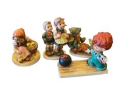 COLLECTION OF FOUR HUMMEL PORCELAIN FIGURINES TWO TM2 AND ONE TM3 INCLUDED