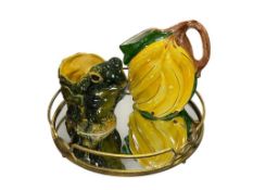 TWO ITALIAN MADE FIGURAL PITHERS BANANAS AND FROF MAJOLICA PITCHER WITH MIRRORED TRAY