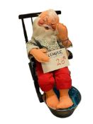 VINTAGE ANNALEE DOLL FEATURING SANTA SOAKING HIS FEET IN A ROCKING CHAIR #5514