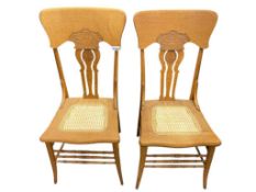 PAIR OF ANTIQUE AMERICAN OAK PRESSED BACK NORTHWIND FACE CARVED CHAIRS WITH CANE SEATS